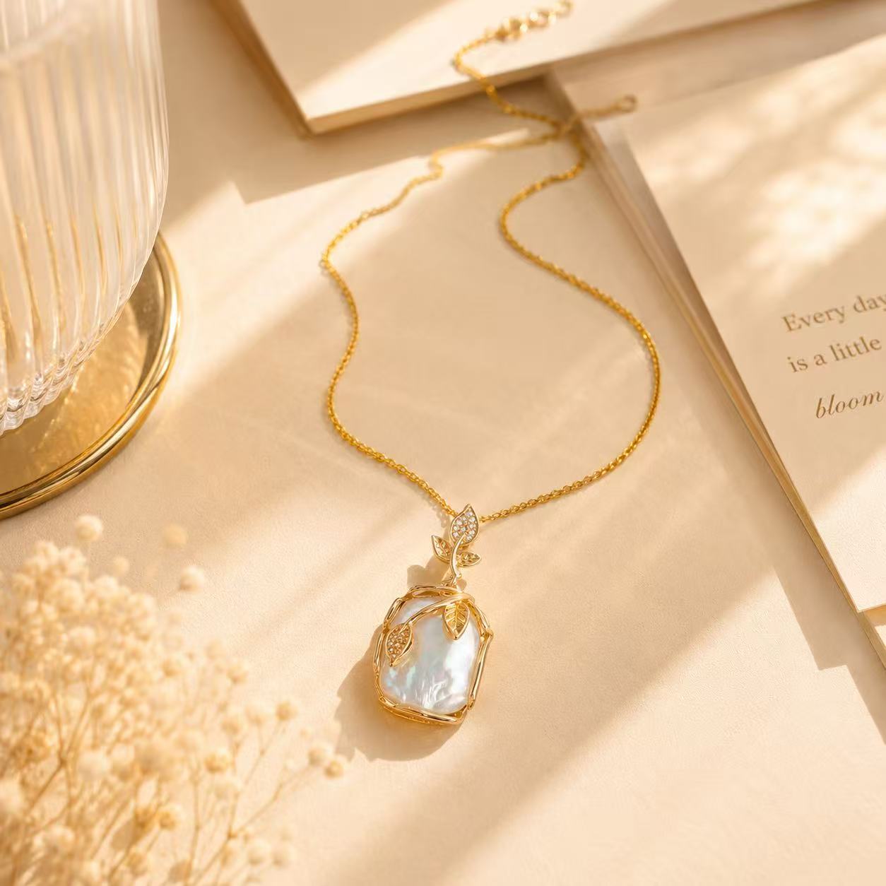 Elegant Gold Leaf Pendant Necklace with Pearl-like Stone and Crystal Accents for Women's Fashion
