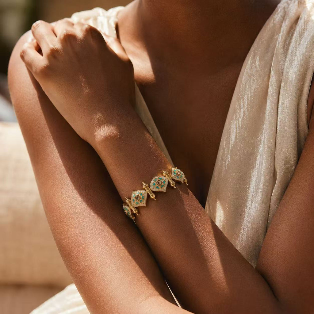 Elegant Gold Tone Bracelet with Green Gemstones and Delicate Design for Women