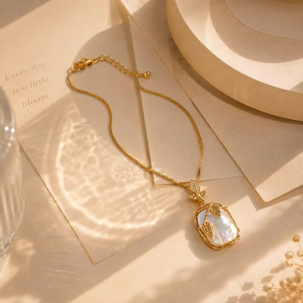Elegant Gold Leaf Pendant Necklace with Pearl-like Stone and Crystal Accents for Women's Fashion