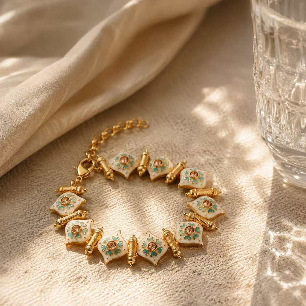 Elegant Gold Tone Bracelet with Green Gemstones and Delicate Design for Women