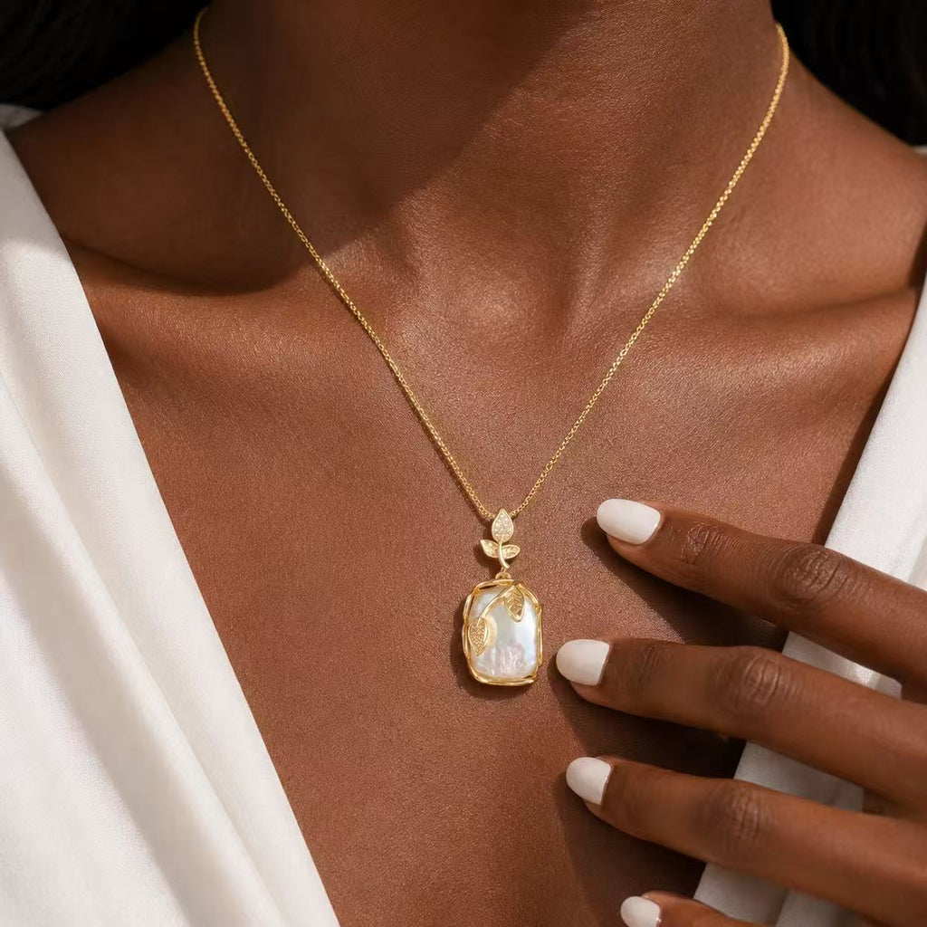 Elegant Gold Leaf Pendant Necklace with Pearl-like Stone and Crystal Accents for Women's Fashion