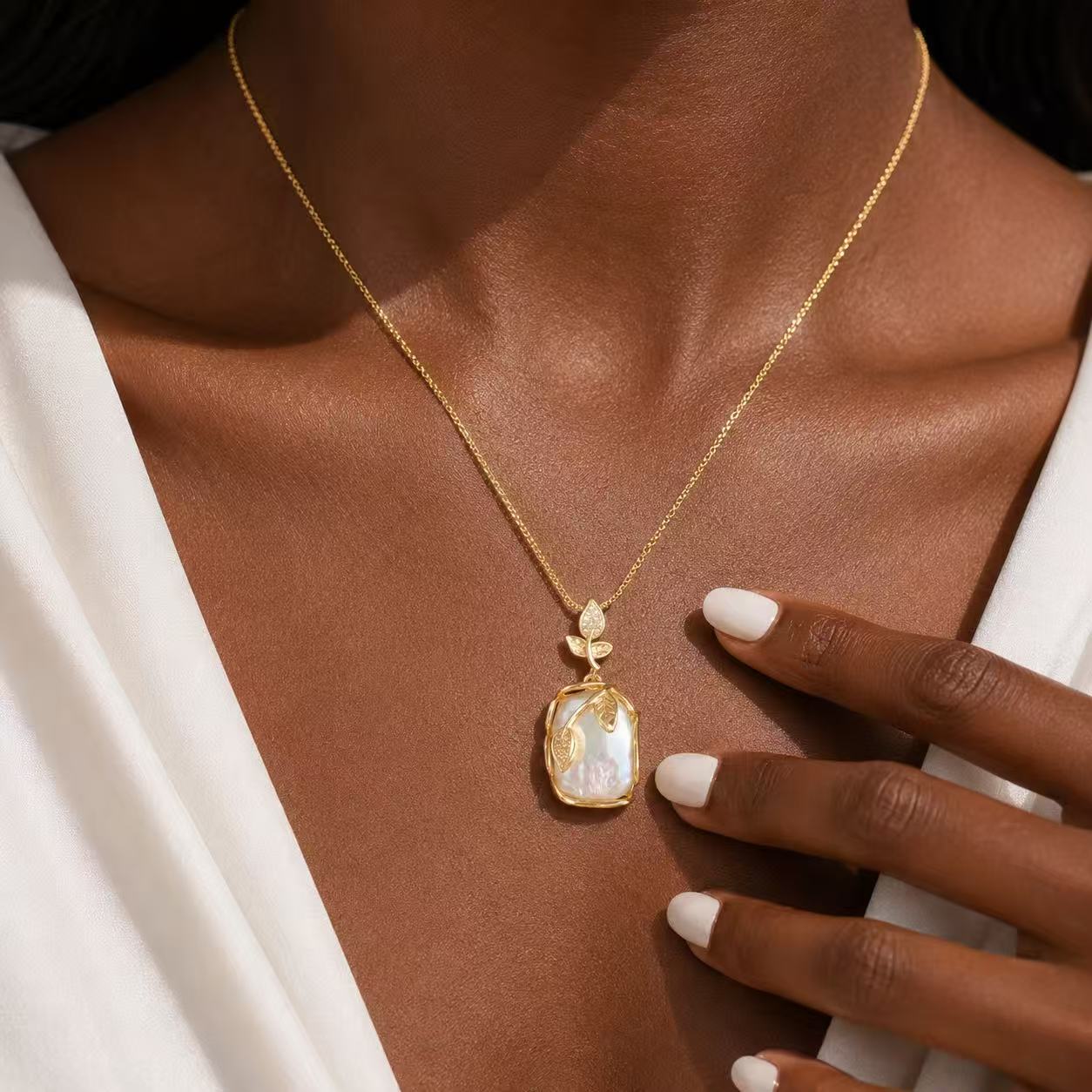 Elegant Gold Leaf Pendant Necklace with Pearl-like Stone and Crystal Accents for Women's Fashion