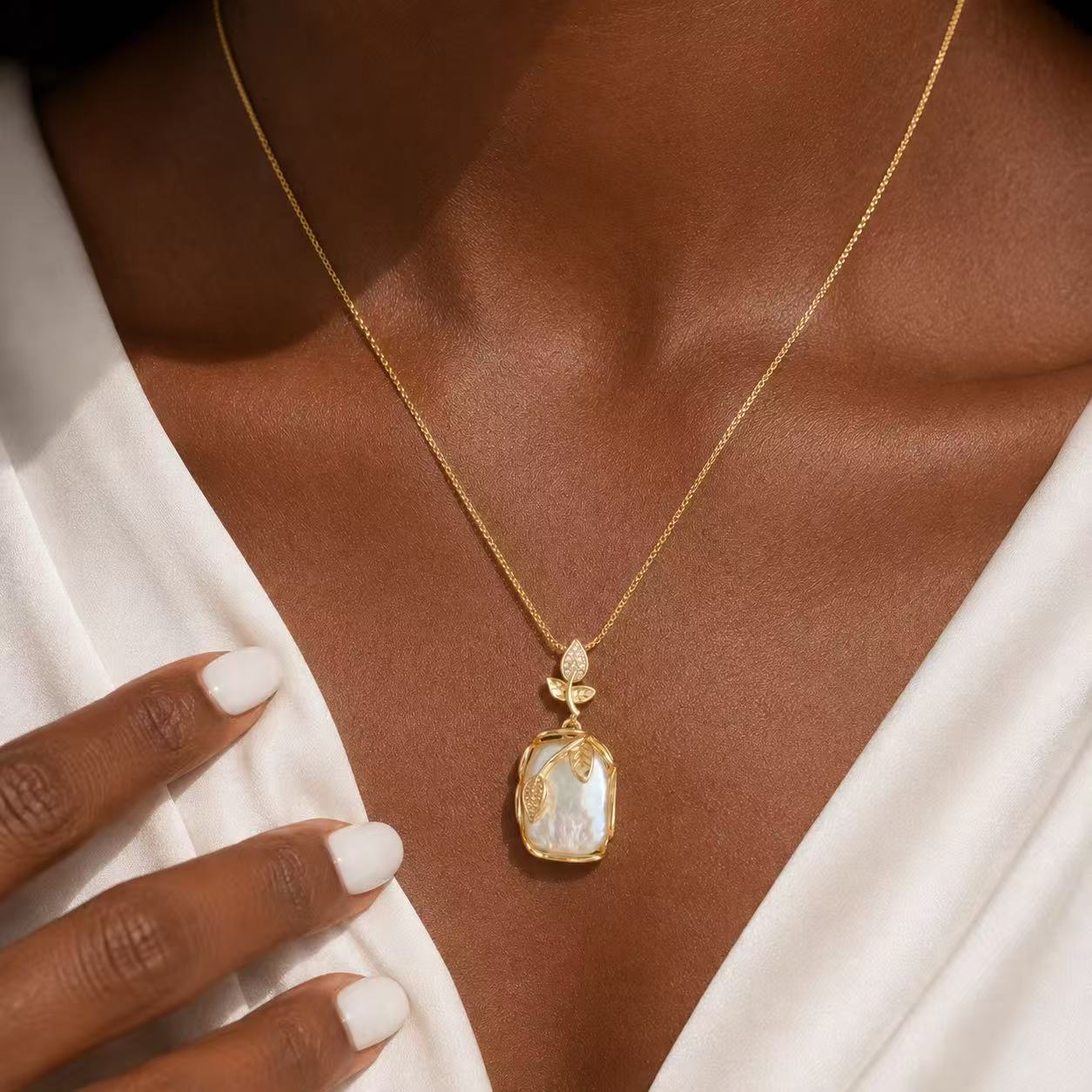 Elegant Gold Leaf Pendant Necklace with Pearl-like Stone and Crystal Accents for Women's Fashion