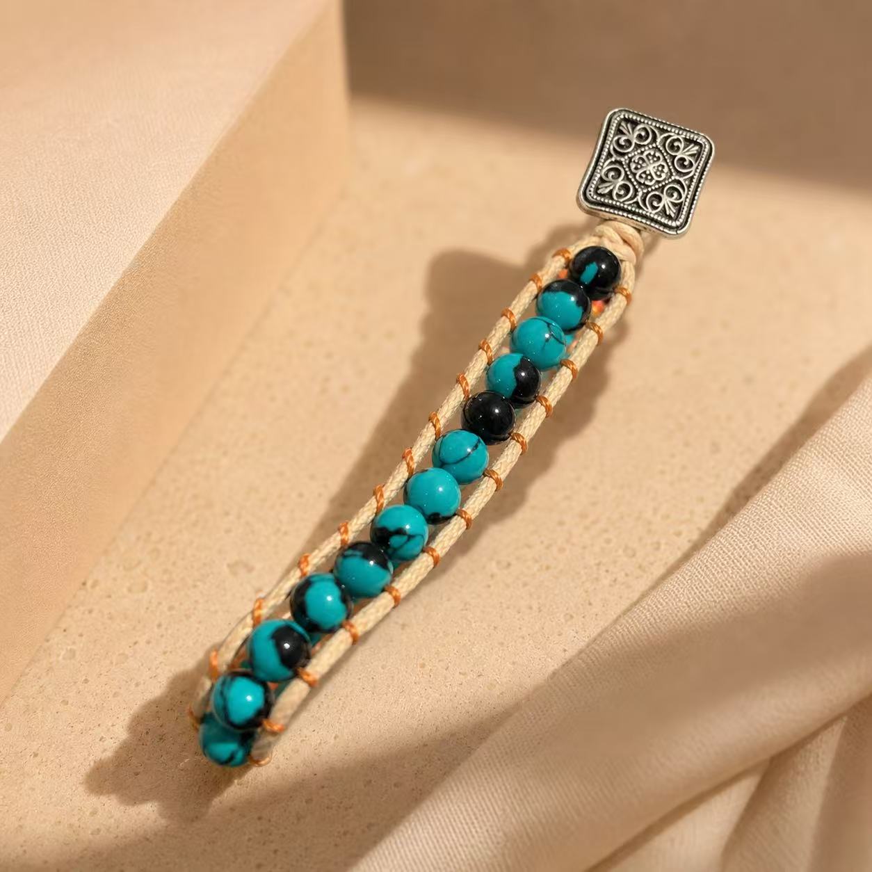 Elegant Turquoise Beaded Bracelet with Intricate Silver Charm for Women's Fashion Accessory