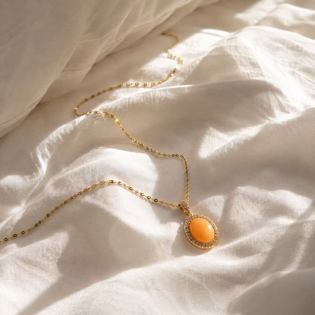Orange Gemstone Necklace for Women Elegant Gold Chain Necklace with Orange Oval Pendant and Sparkling Halo Design for Women